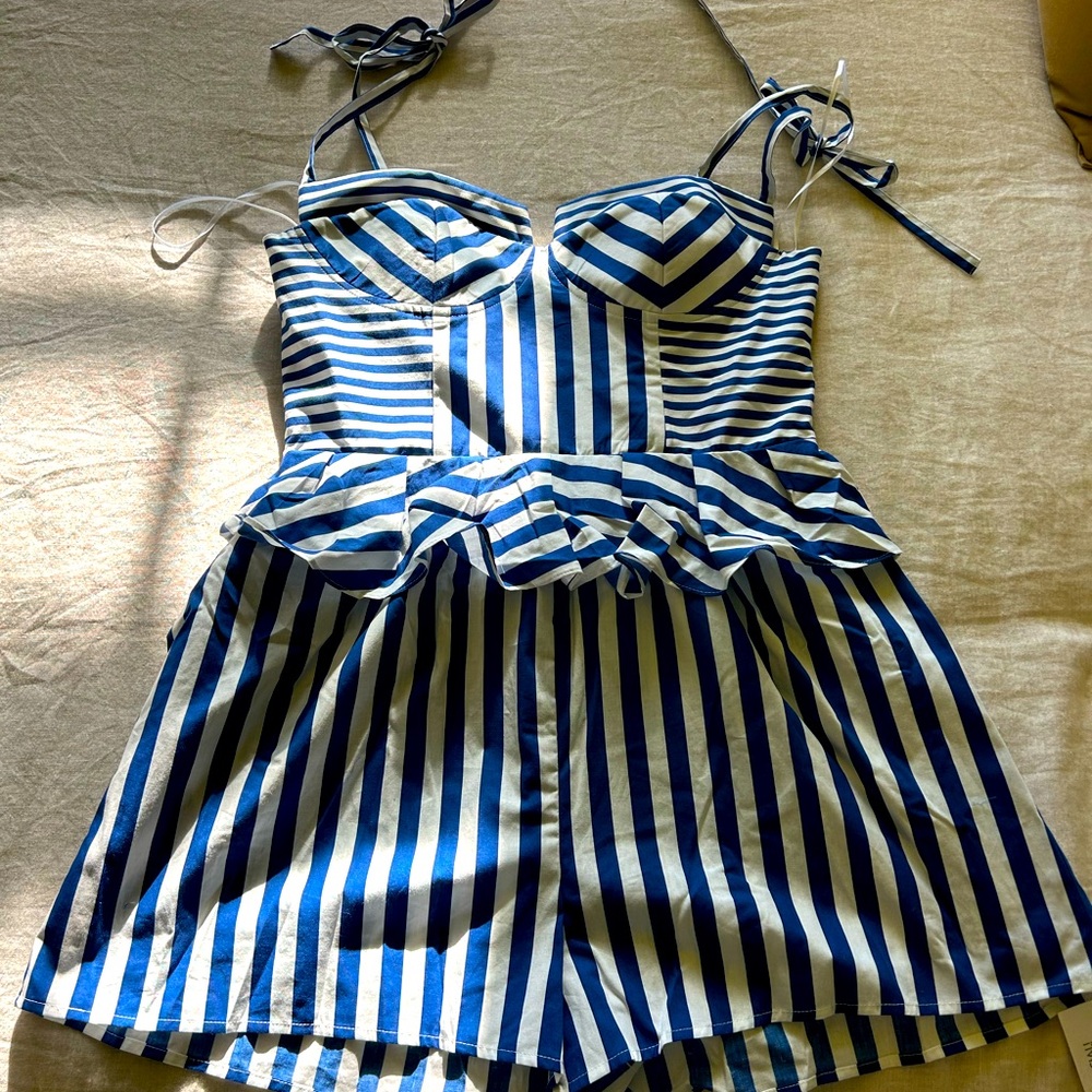 Yumi Kim Vera Romper.
Blue and White striped.
Size M.
New with tags.